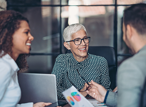 Three people in a business meeting